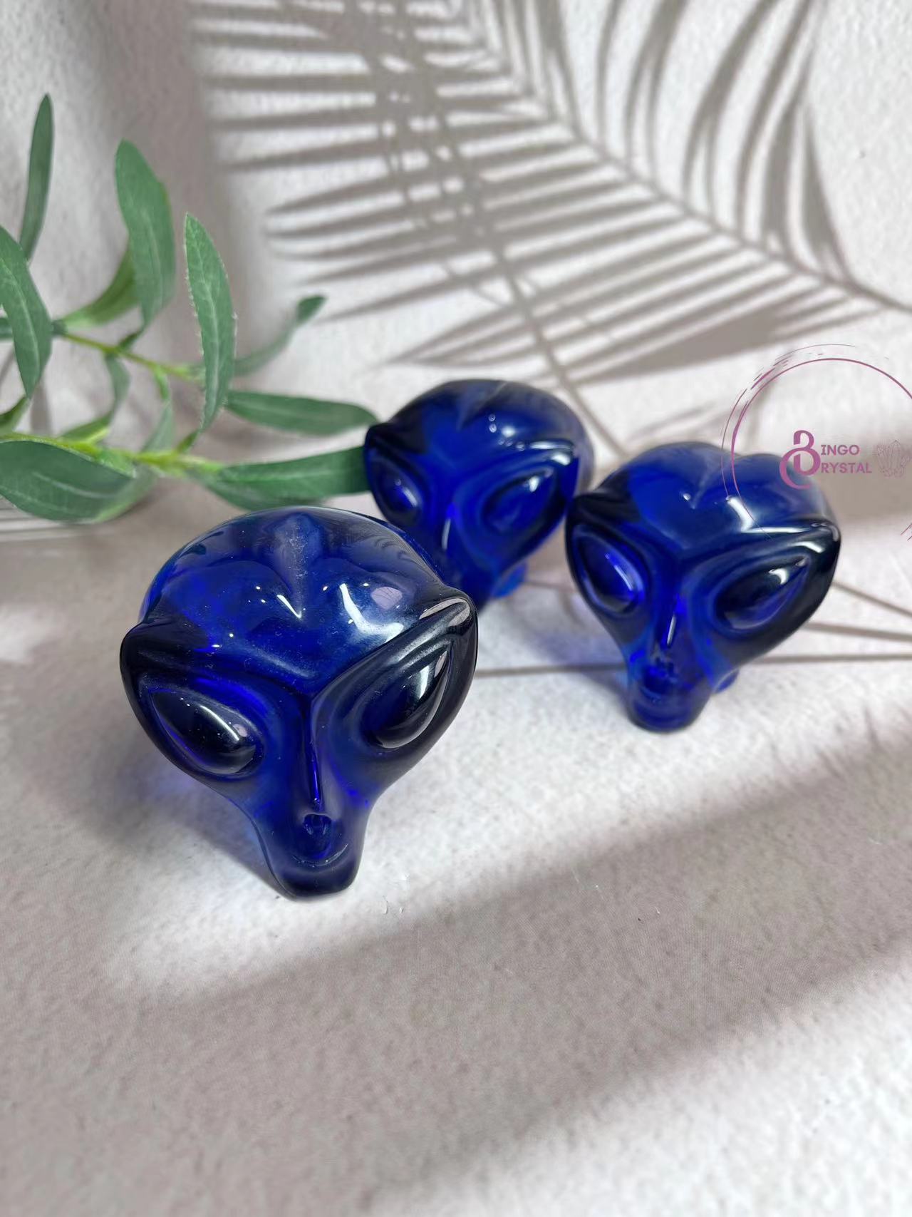 Blue Glass Alien Carvings