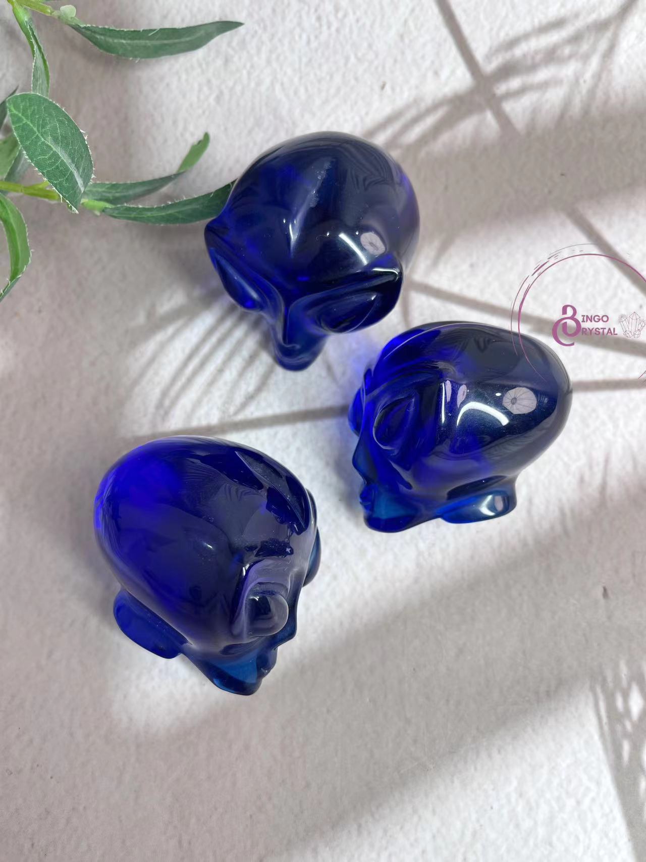 Blue Glass Alien Carvings